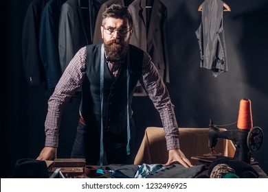 In search of inspiration. Bearded man tailor sewing jacket. business dress code. Handmade. retro and modern tailoring workshop. sewing mechanization. suit store and fashion showroom. In his own style.