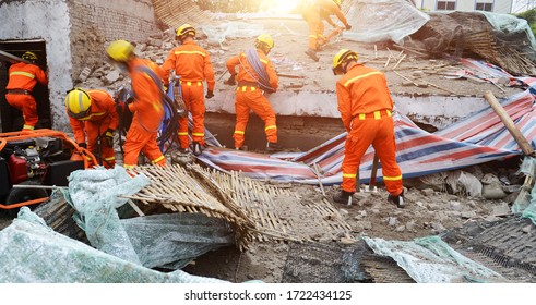 Search and rescue forces searching through a destroyed building.