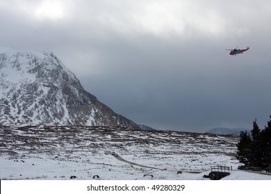 Search And Rescue Helicopter Navy Seaking Flying Around Glencoe In Winter