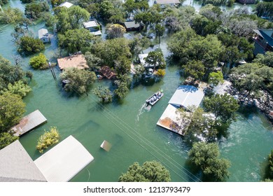 Search and rescue out after natural disaster major flooding leaves central Texas underwater and entire community and neighborhood flooded. Homes and houses flooded, home insurance needed