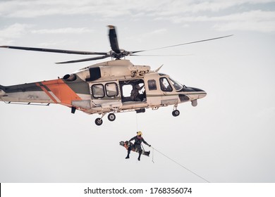 Search And Rescue SAR Helicopter Team Hoists An Injured Person