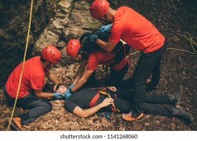 Search And Rescue Team Helping Injured Alpinist