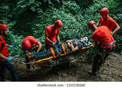 Search And Rescue Team Helping Injured Alpinist