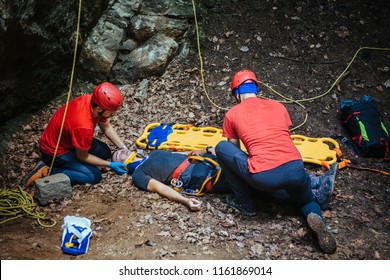 Search And Rescue Team Helping Injured Alpinist