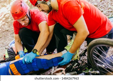 Search And Rescue Team Helping Injured  Bicyclist