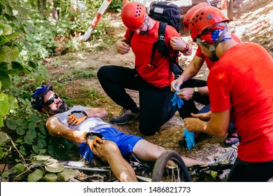 Search And Rescue Team Helping Injured  Bicyclist