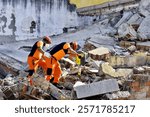 Search and rescue teams are working in the debris field