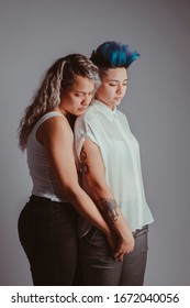 Search For Sexual Orientation In Young Millennial People. Transgender Community. Lgbt Pride Concept. Real Lesbian Couple Hugging And Kissing In White Background With Copy Space. Homosexual Symbol.