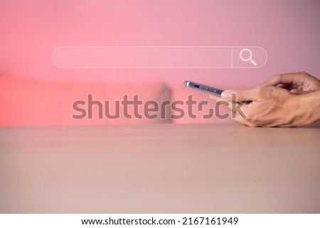 Search technology, search engine optimization, man's hand using smartphone to search information, using search bar function on your website. SEO.