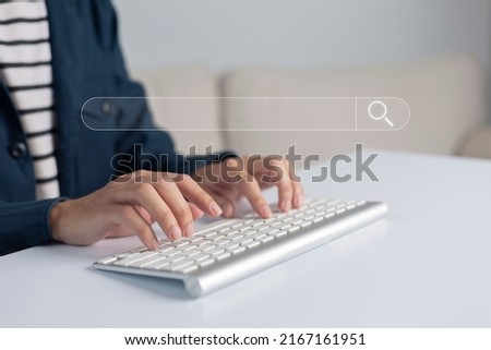 Search technology, search engine optimization, man's hand using computer keyboard to search information, using search bar function on your website. SEO.