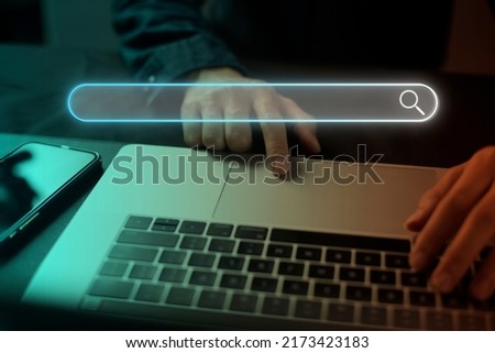 Search technology, search engine optimization, man's hand using laptop to search information, using search bar function on your website. SEO.