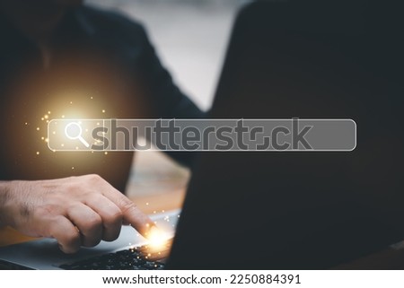 SearchEngine Optimization SEO Networking Concept.handof businessman working with computer laptop on desk in office.Searching Browsing Internet Data Information with blank search bar.