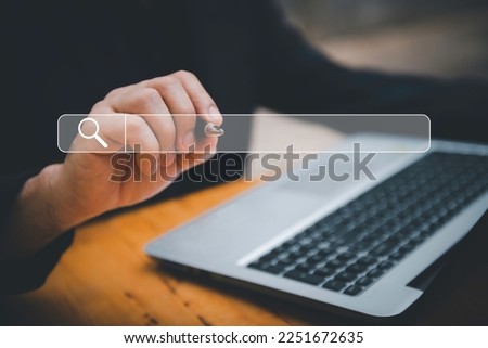 SearchEngine Optimization SEO Networking Concept.handof businessman working with computer laptop on desk in office.Searching Browsing Internet Data Information with blank search bar.