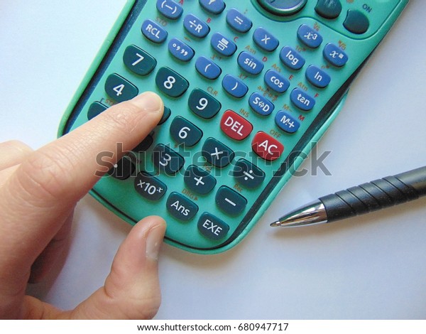 searching for answers\
with calculator and\
pen
