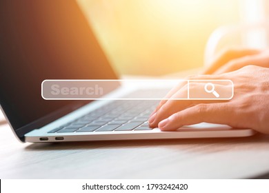 Searching browsing data information network concept. Businessman using laptop computer to input keyword for search and find knowledge.