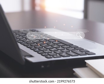 Searching Browsing Internet Data Information with icon on virtual screen blank search bar over laptop on wooden table in home or office. Search Engine Optimization SEO Networking Concept.