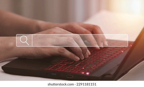 Searching Browsing Internet Data Information with search bar, Search Engine Optimization SEO, Network concept, Businessman hands working with laptop computer on the sofa in the house.