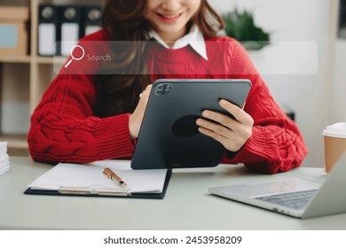 Searching Browsing Internet Data Information Networking Concept with blank search bar. woman working with mobile phone and laptop computer VR icon in office
 - Powered by Shutterstock