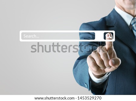Searching Browsing Internet Data Information Networking Concept,Business man clicking internet search page on computer touch screen,copy space.
    
    - Image