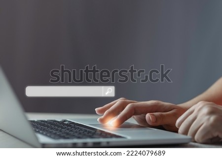 Searching Browsing Internet Data Information with blank search bar.SearchEngine Optimization SEO Networking Concept.handof businessman working with computer laptop on desk.