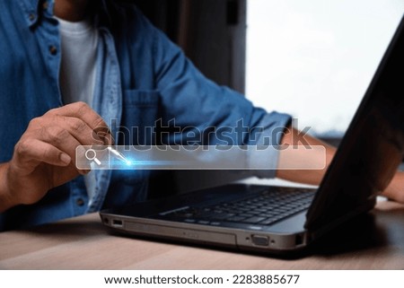 Searching Browsing Internet Data Information with blank search bar.SearchEngine Optimization SEO Networking Concept.hand of businessman working with computer laptop on desk in office
