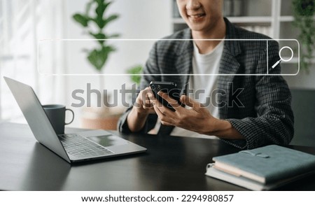 Searching Browsing Internet Data Information Networking Concept with blank search bar.man working with mobile phone and laptop computer VR icon in office