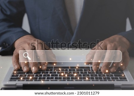 Searching Browsing Internet Data Information with blank search bar.SearchEngine Optimization SEO Networking Concept.handof businessman working with computer laptop on desk in office.