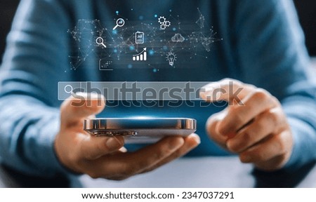 Searching browsing Internet data Information with blank search bar.Search engine optimization SEO networking concept.hand of businessman working with smartphone