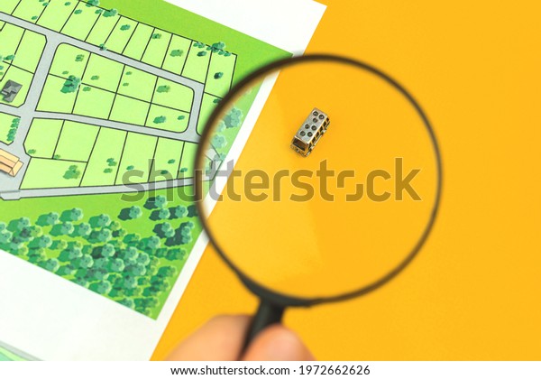 Searching car for\
relocation, family moving to new house concept background, office\
desk photo with real estate\
map