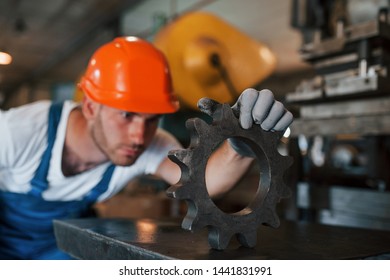 Searching for defects. Man in uniform works on the production. Industrial modern technology. - Shutterstock ID 1441831991