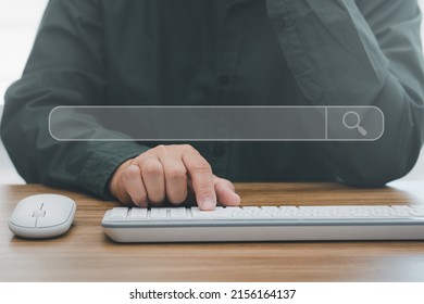 Searching Information Data On Internet Networking Concept. Man Typing Desktop Keyboard Searching Data And Mouse Computer On Wood Table