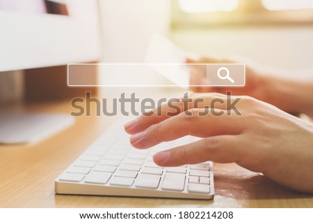 Searching information data on internet networking concept. Hand of male typing text on laptop keyboard