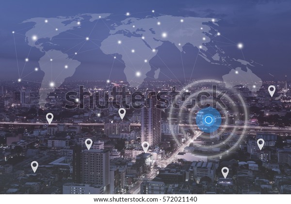Searching location on map and pin above\
blue tone city scape and network connection, internet of things,\
globalization satellite navigation system\
concept