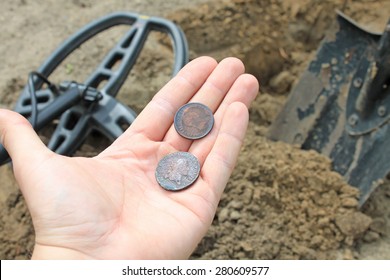 Searching With Metal Detector. Coins In Hand