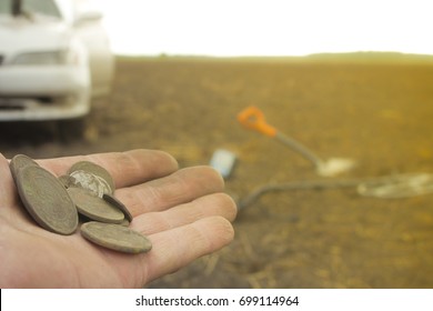 Searching With Metal Detector. Coins In Hand