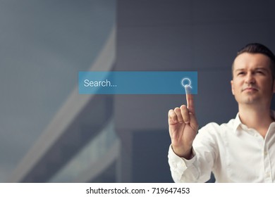 Searching Online. Man Browsing The Internet By Pressing Search Button On Browser Tab On Digital Display.