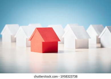 Searching for real estate property, house or new home, red paper house standing out - Shutterstock ID 1958323738