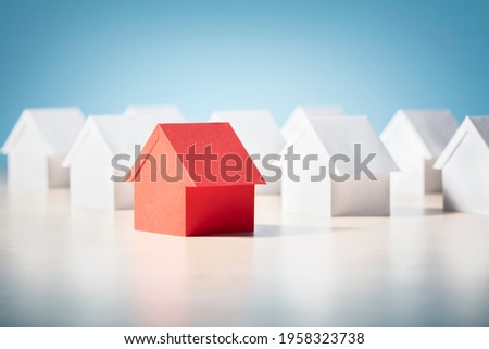 Searching for real estate property, house or new home, red paper house standing out