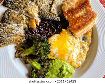 Seared Fish with Soba Noodles and Sunny-Side-Up Egg Eye-Level View - Powered by Shutterstock