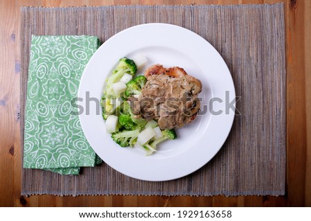 seared pork chop, mushroom gravy with kohlrabi, a ketogenic diet meal