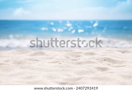 Seascape abstract beach background. blur bokeh light of calm sea and sky. Focus on sand foreground.