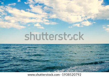 Seascape background wavy blue sea and sky with clouds