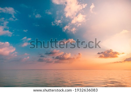 Seascape beach and colorful dream summer sky. Panoramic beach landscape. Empty ocean view, horizon seascape. Orange and golden sunset sky, sun rays, calmness, tranquil relaxing sunlight, summer mood