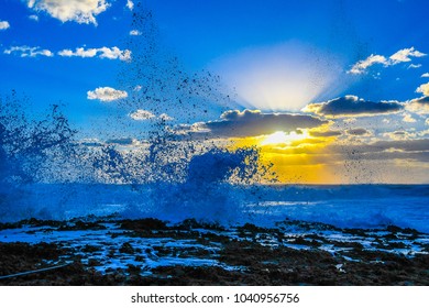 A Seascape Of Breaking And Splashing Waves On A Rocky Florida Beach