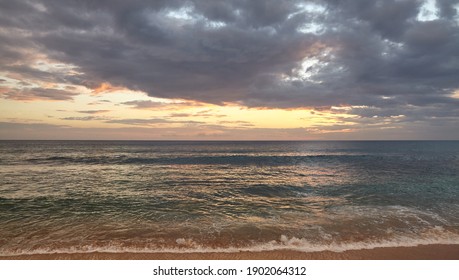Seascape with dramatic cloudscape at sunset.
