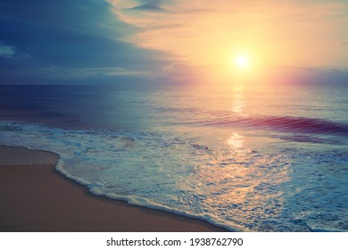 Seascape in early morning, sunrise over sea. Calm sea with beautiful sky. Nature landscape. Sandy beach in summer