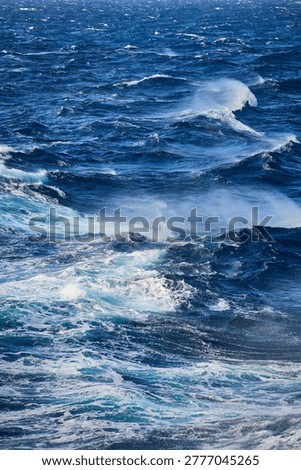 Seascape featuring rows of breaking waves and whitecaps under a clear sky, Aegean Sea, South Aegean, Greece, Europe