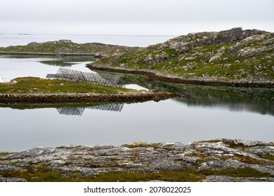 A seascape with a fish drier frame in northern Norway, close to Nordkapp