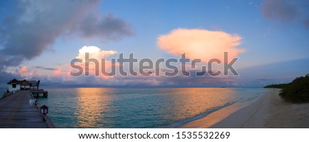 Seascape lit by the first rays of dawn, Maldives.