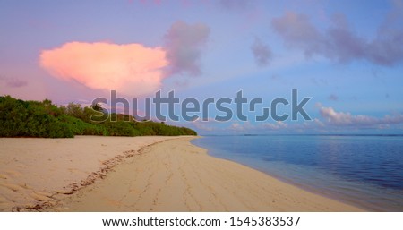 Seascape lit by the first rays of dawn, Maldives.